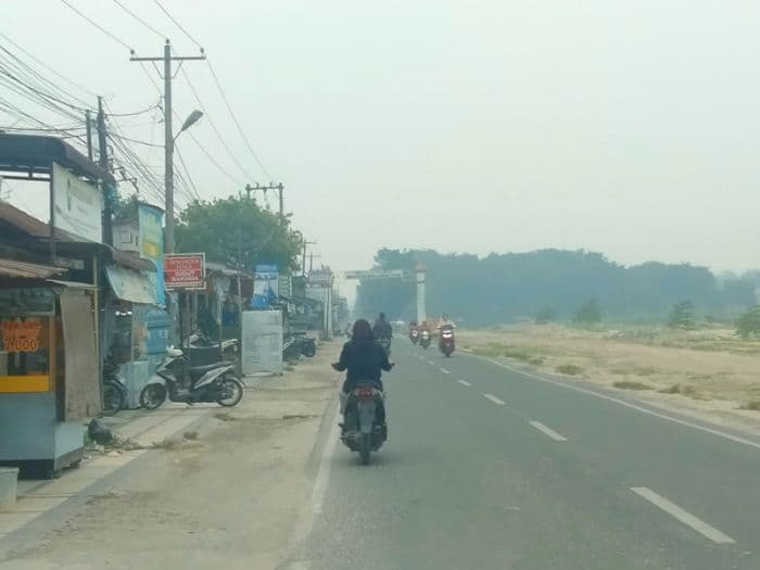 kabut_asap_tipis_selimuti_kisaran_warga_mulai_gunakan_masker